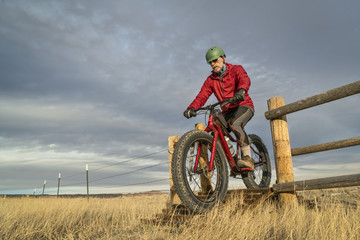 riding a mountain fat bike over cattle guard