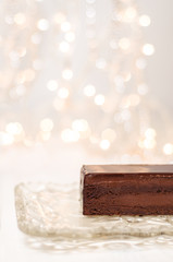 Vertical image beautiful chocolate cake and bokeh background 