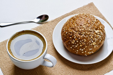 Coffee cup and croissant breakfast in the morning 