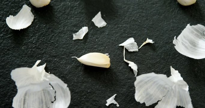 Close-up of garlic and peeled 