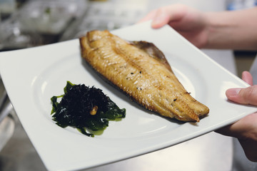 Hokke grilled put on dish in hand