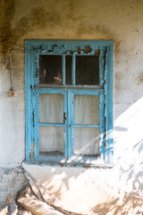 Old windows. Old windows in the wall of an abandoned house. Windows with irradiated frames