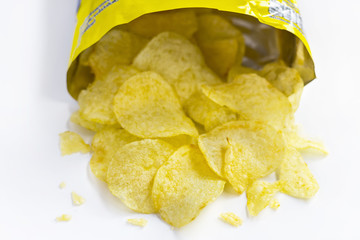A pile of potato chips on white background