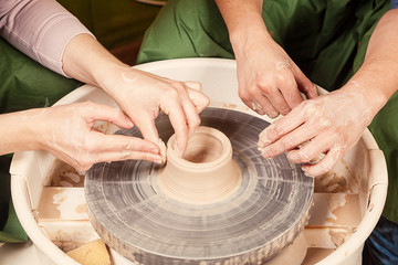 woman potter teaches