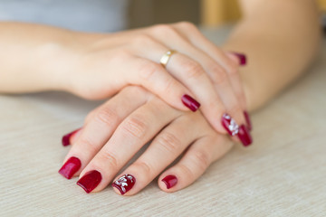 Elegant red manicure for woman