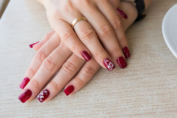 Elegant red manicure for woman