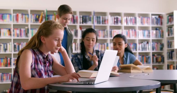 Schoolkids studying in library 4k