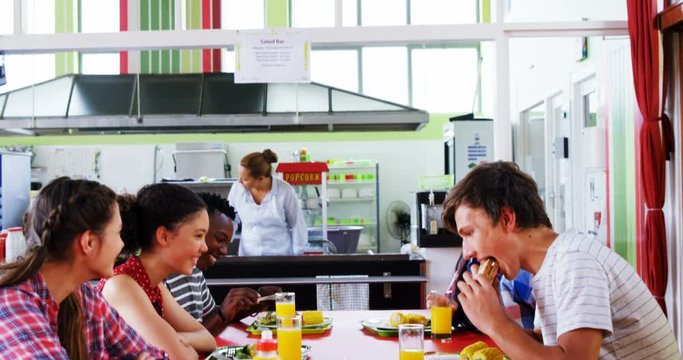 Schoolkids having lunch together 