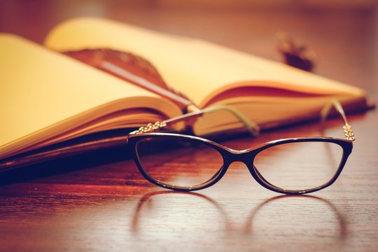 Notepad and eyeglasses