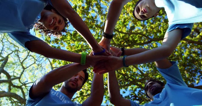 Volunteers forming a hand stack 