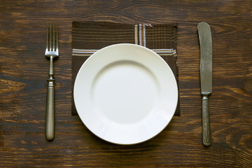 Cutlery, plate and napkin on the table