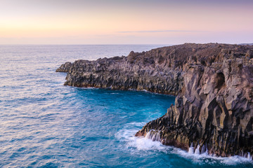 Stunningly beautiful lava caves and cliffs in Los Hervideros after sunset. Lanzarote. Canary Islands. Spain