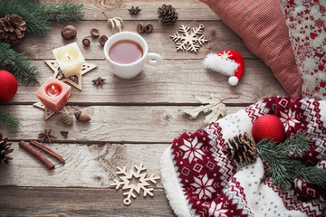 candles and Christmas decoration on wooden background