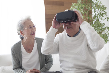 An old couple playing VR