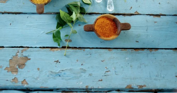 Various spices and herbs on wooden table 