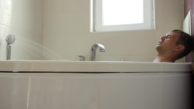 man taking a bath. 4k, slow motion