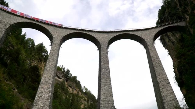 The train passes through the famous Landwasser viaduct in Switzerland. Bottom view.