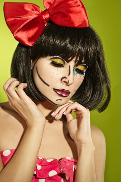 Funny mime girl with a red bow