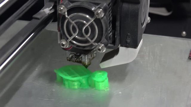 3D printer prints green form closeup, 4k
