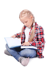 Cute little girl with books on white background