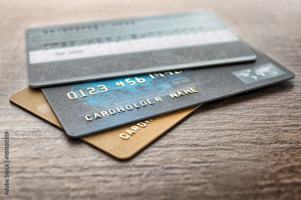 Wall mural Different credit cards on table, closeup