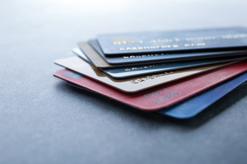 Pile of credit cards on table, closeup