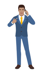 Businessman pointing his finger at the mobile phone