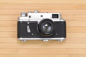 Old camera on wooden table