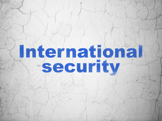 Protection concept: Blue International Security on textured concrete wall background