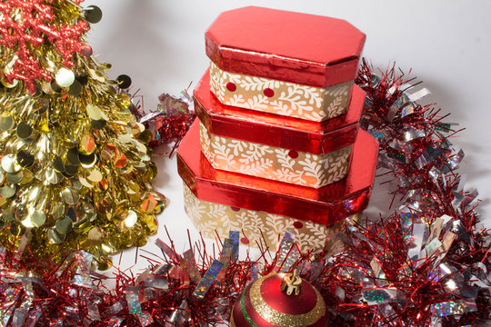 Three Red and Gold Christmas Gift Boxes