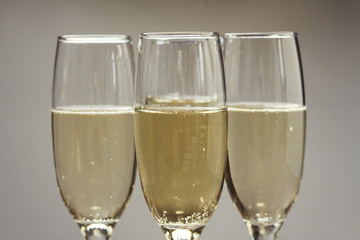 Background with three glasses of champagne