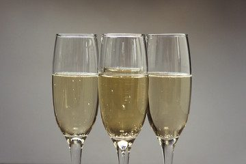Three glasses of champagne. Background.