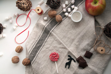 New year mood. the expectation of the holiday. vintage watches, chocolates, marshmallows, sweets, candies, lollipops. winter.