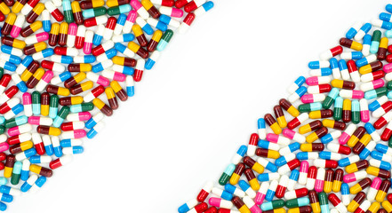 Colorful of antibiotic capsules pills on white background with beautiful pattern and copy space. Drug resistance concept. Antibiotics drug use with reasonable and global healthcare concept.