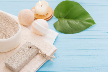 Spa concept with candles on blue wooden background