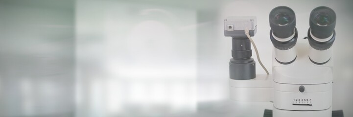 Fototapeta na wymiar Composite image of microscope in laboratory 