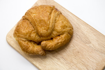 Croissant on wooden