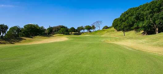 Fototapeta premium Panorama view of Golf Course where the turf is beautiful and green in Chiba Prefecture, Japan. Golf is a sport to play on the turf