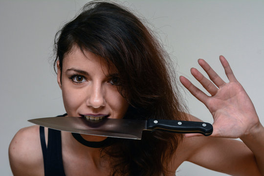 Dangerous woman holding a knife