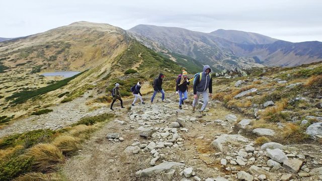 Group of young people hiking in mountains