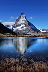 Photo sur Plexiglas Cervin Mt Matterhorn reflected in Riffelsee Lake Zermatt Canton of Valais Switzerland