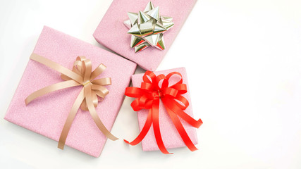 Three pink gift box on a white background.