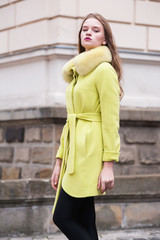 Beautiful young woman walking through the streets of Paris