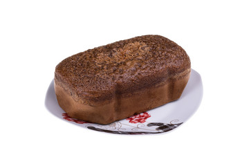 Homemade cocoa cake with walnuts and raisins baked in bread maker isolated on white background