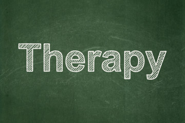 Fototapeta premium Healthcare concept: text Therapy on Green chalkboard background