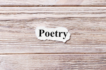 poetry of the word on paper. concept. Words of poetry on a wooden background