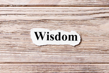 wisdom of the word on paper. concept. Words of wisdom on a wooden background