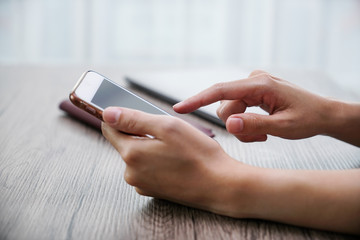 the women hand use mobile phone , shopping online