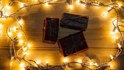 New Year's gifts on the background of festive bright lights concept of the New Year holiday