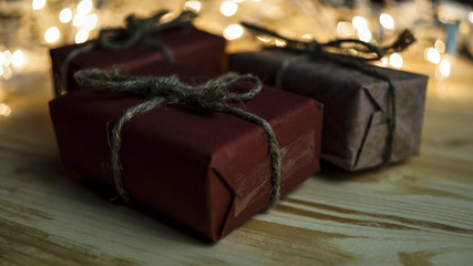 New Year's gifts on the background of festive bright lights concept of the New Year holiday